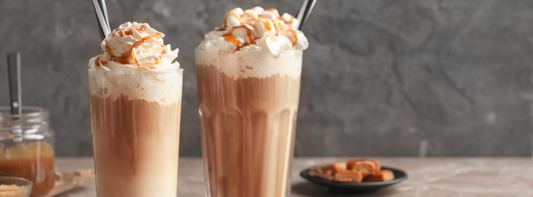 glasses of iced caramel latte and caramel frappe