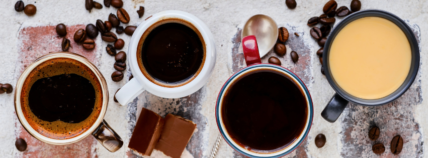 line up of black coffees to argue what is the strongest coffee.